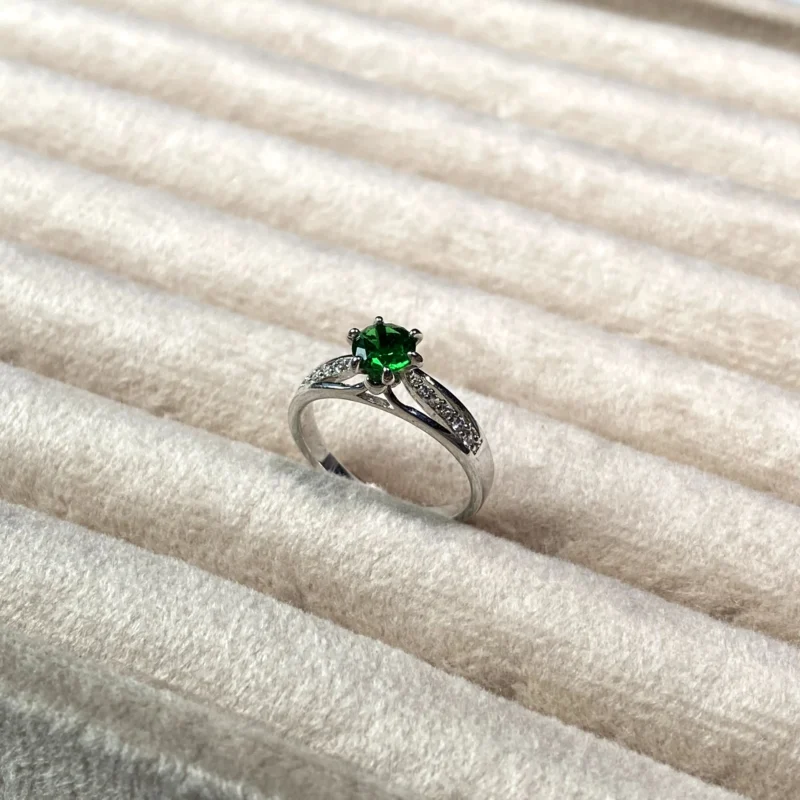 rhodium plated silver ring with green stone