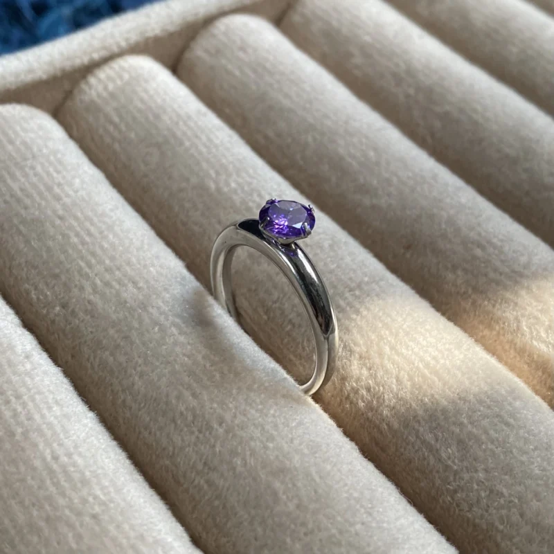 Platinum plated silver ring with purple stone