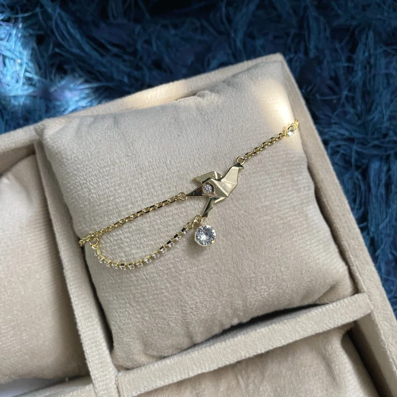 gold bird bracelet